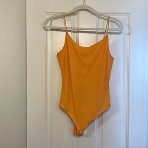 Orange ribbed spaghetti strap body suit